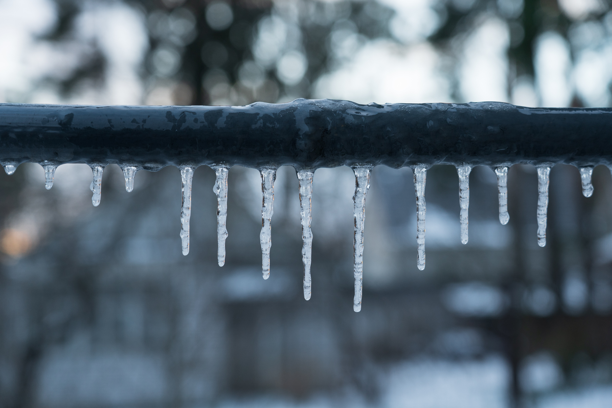 Frozen pipe with icicles